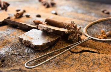 Sweet spices ,  chocolate on a table black