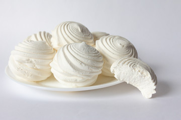 white cream marshmallow lies on a plate