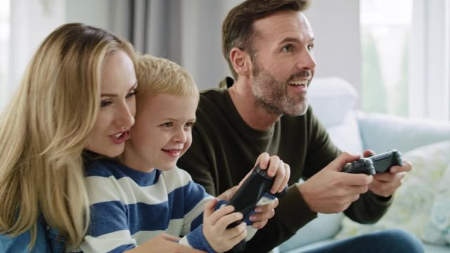 Family playing video game together