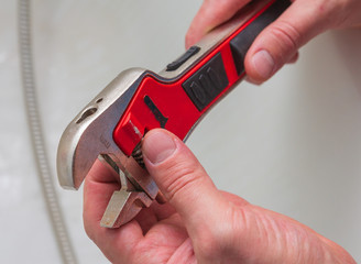 male hands holding a caliper