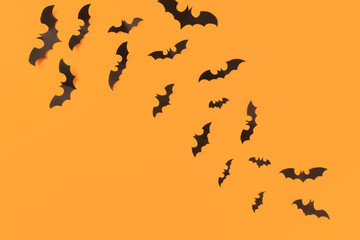 Halloween paper decorations on orange background. Halloween concept. Flat lay, top view, copy space - Image