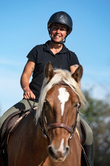 Obraz premium riding girl and comtois horse