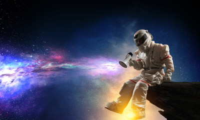 Naklejka premium Spaceman and the planet Earth abstract theme