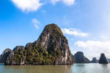 Naklejka premium Ha Long Bay Unesco Heritage site in Northeast Vietnam Indochina known for emerald waters and towering limestone islands topped by rainforests