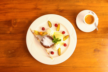 dessert plate with caffe on wooden table, ready to enjoy some good Europena and Swiss food