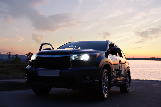 Modern New Car On Road Near River