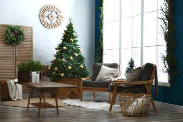 Beautiful interior with decorated Christmas tree in living room