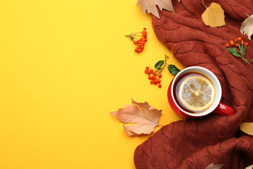 Flat lay composition with hot drink on yellow background, space for text. Cozy autumn