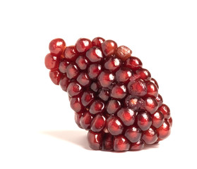 ripe pomegranate berries on a white background