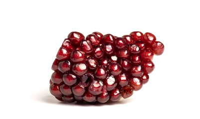 ripe pomegranate berries on a white background