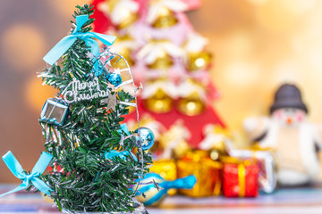 Merry Christmas New Year collection, gifts and decorative ornaments. Holiday Season background with decorations. Blue, green xmas trees. Gift boxes various colours. Copy space for text.