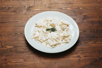Homemade tagliatelle with white sauce