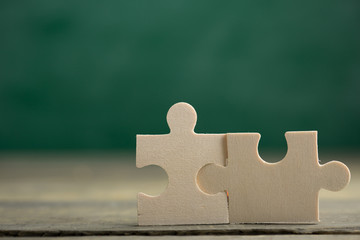 Creative solution for idea - business concept, jigsaw puzzle on the blackboard