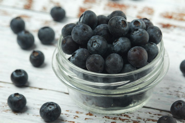 A glass bowl with blueberry