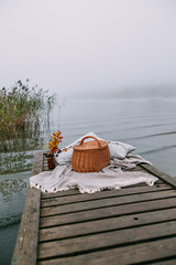 picnic on a foggy morning by the lake. Autumn concept