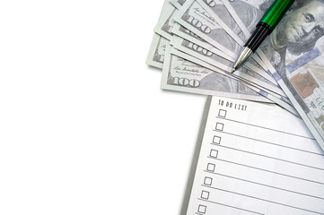 Reminder note to do list with dollars bank note and pen on white background.