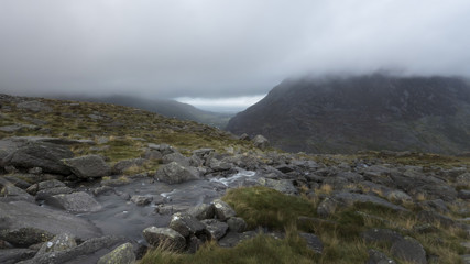 Wet raining weather in Snowdonia with rocky stream in the Mountains