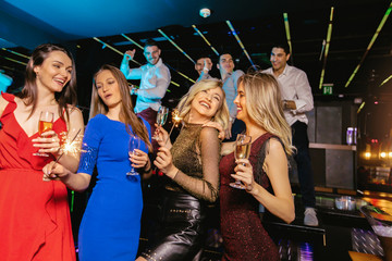 Group of friends partying in a nightclub