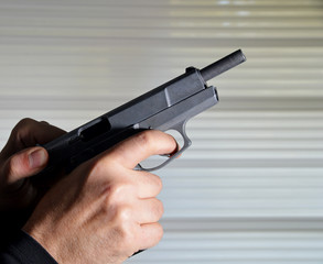 hand with a gun