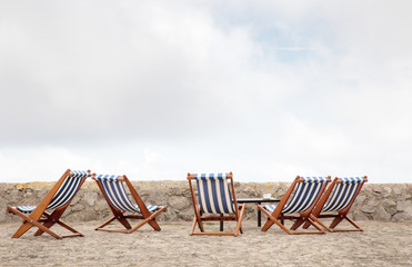 deck chairs standing on a patio