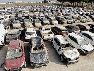 Aerial view new damaged cars due to flooding in dirt, spoiled can not be restored and used, gota fria September 2019, Orihuela, Torrevieja, Spain
