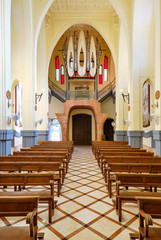 Fototapeta premium View to the ceiling and pipe organ musical instrument inside of Sanctuary of Santa Maria Magdalena in Novelda town, spanish Art Nouveau masterpiece in Spain