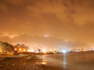 Naklejka na ściany i meble Overview of Lebanese coast by night. Jounieh and Beirut lights in the night