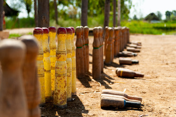 close up of bitlles catalanes, a traditional catalan bowling game where wooden pins, "bolos catalanes" are used, in countryside outdoor
