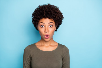 Fototapeta na wymiar Photo of excited trendy attractive charming black millennial hipster astonished about she sees sales and goods discounted isolated over vivid blue color background