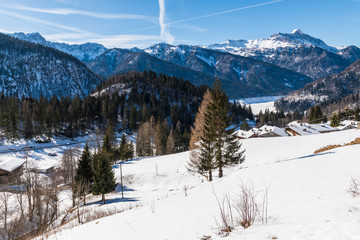 Winter in Sauris di Sotto. Magic of snow and old wooden houses. Italy