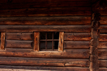 Obraz na płótnie Canvas Windows of old wooden village houses made of logs