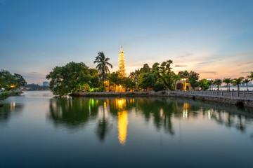 Fototapeta na wymiar Tran Quoc pagoda, the oldest Buddhist temple in Hanoi, at twilight. The famous destination travel in Hanoi