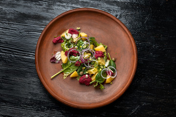 Boiled potatoes with dill and beetroot paste. Sprinkled with onions and capers.