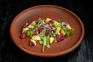 Boiled potatoes with dill and beetroot paste. Sprinkled with onions and capers.
