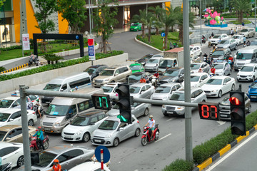 Traffic light with street traffic on background in Hanoi street