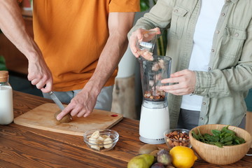 Young married couple makes a smoothie
