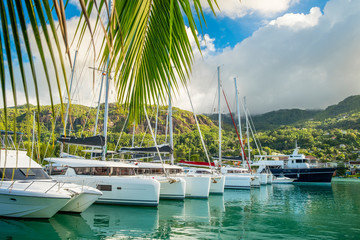 Luxury yachts and Boats  in sunny summer day at marina of Eden Island, Mahe, Seychelles