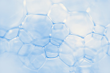 Micrograph of foamy chemical fluid. The chain of compounds of microparticles