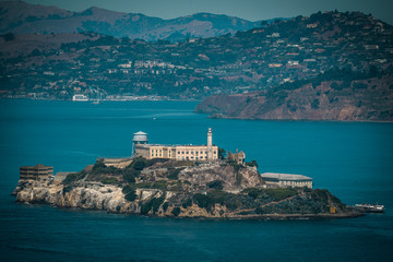 View of Historical Alcatraz Prison Island in San Francisco California from the far - obrazy, fototapety, plakaty
