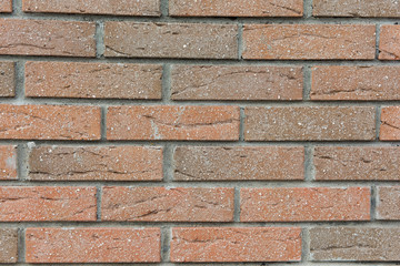 Old city wall of bricks of various colors