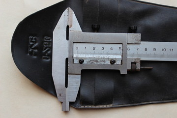 Close up calliper. Measuring tape