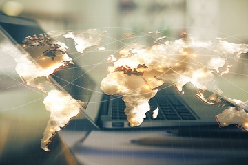 Double exposure of business theme icons and work space with computer background. Concept of success.