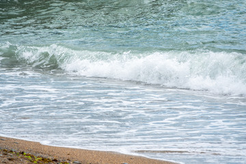 Soft wave of the sea on the sandy beach