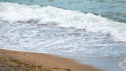 Soft wave of the sea on the sandy beach