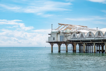 Platform on supports in the sea near the shore.
