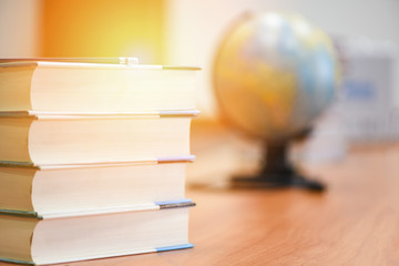 Book in library with book stacked and earth globe model map - Education concept back to school and business study global world