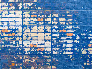 Painted blue distressed old brick wall texture. Grunge desing.