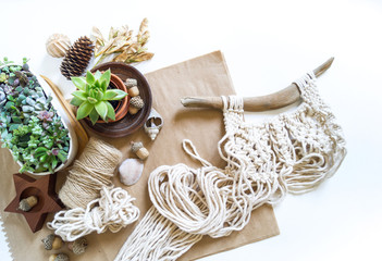 Macrame weaving from natural cotton threads. Home decor vintage boho style. © Дарья Колпакова