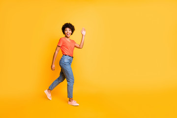 Fototapeta na wymiar Copyspace photo of charming cheerful cute attractive gorgeous girlfriend waving on you walking past you while isolated over yellow vivid color background