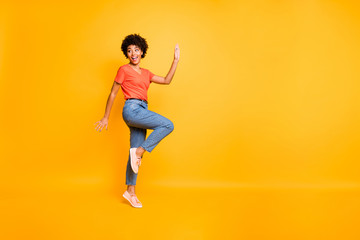 Fototapeta na wymiar Copyspace photo of cheerful charming fascinating gorgeous nice cute girlfriend running away from something changing position isolated over vivid color yellow background